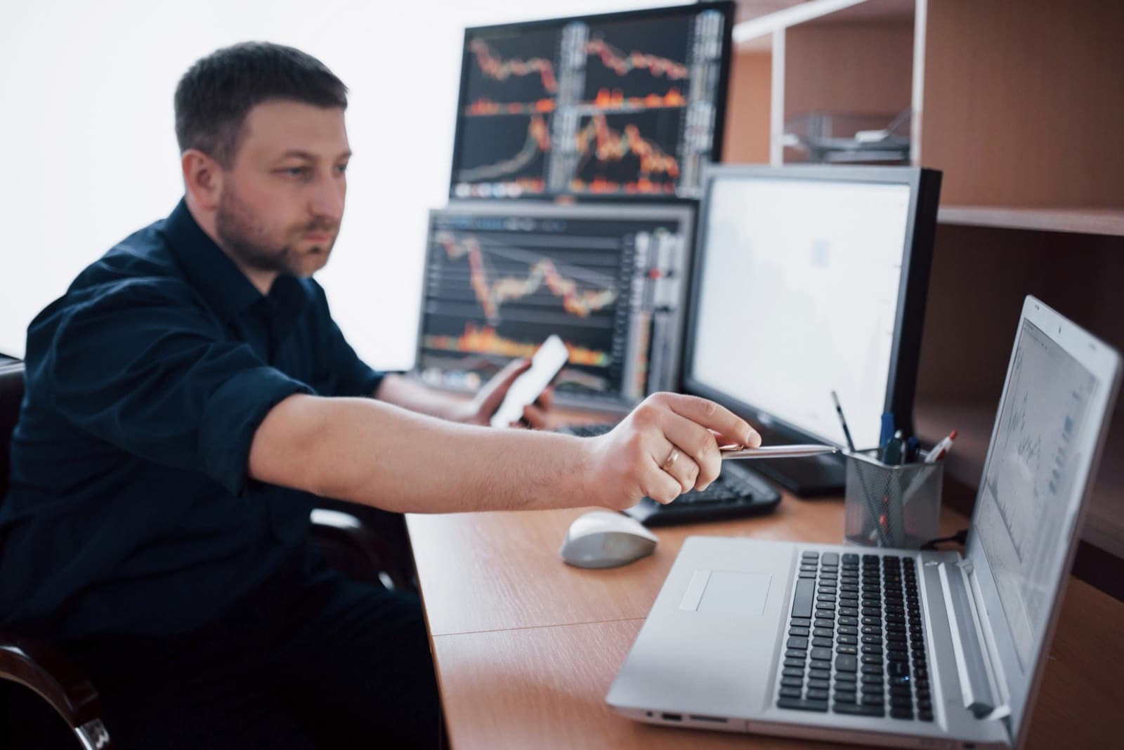 Security operations analysts monitoring data feeds on multiple displays